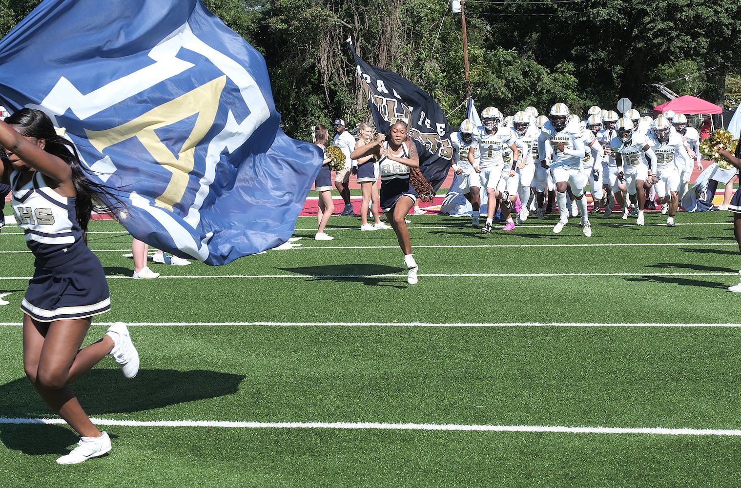 The Apalachee team takes the field lead by the cheer squad.
Apalachee High School returned to the field against Athens Clarke Central Saturday September 28, 2024 in their first game since the school schooting earlier in the month.

 Nell Carroll for the Journal Constitution