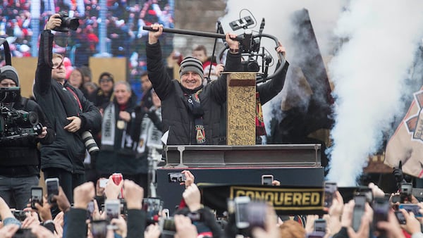 Atlanta United outgoing manager Gerardo "Tata" Martino is applauded after hammering the Golden Spike during the MLS championship rally Monday, Dec. 10, 2018, at Mercedes-Benz Stadium in Atlanta.