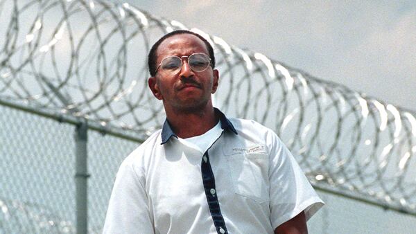 Convicted killer Wayne Williams is pictured in May 1999 near the fence line at Valdosta State Prison in Valdosta, Ga. Williams, now 60, is serving life in prison in the murders of Nathaniel Cater, 27, and Jimmy Ray Payne, 21, who were among about 29 black men and boys slain in and around Atlanta during a 23-month killing period from 1979 to 1981. The series of killings, the majority of which were of children, became known as the Atlanta child murders. Williams was never convicted of any of the children’s slayings. 