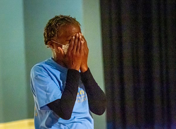 Mays High School teacher Sonja Lewis reacts after learning she won a free trip including airfare and hotel accommodations to any Delta Vacations destination within the U.S., Mexico, or the Caribbean Friday, May 7 2021.  STEVE SCHAEFER FOR THE ATLANTA JOURNAL-CONSTITUTION