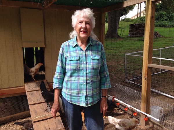 Linda Lay, the daughter of Georgia Tech coaching great Bobby Dodd, stands in a coop in the backyard of her home in Smyrna.