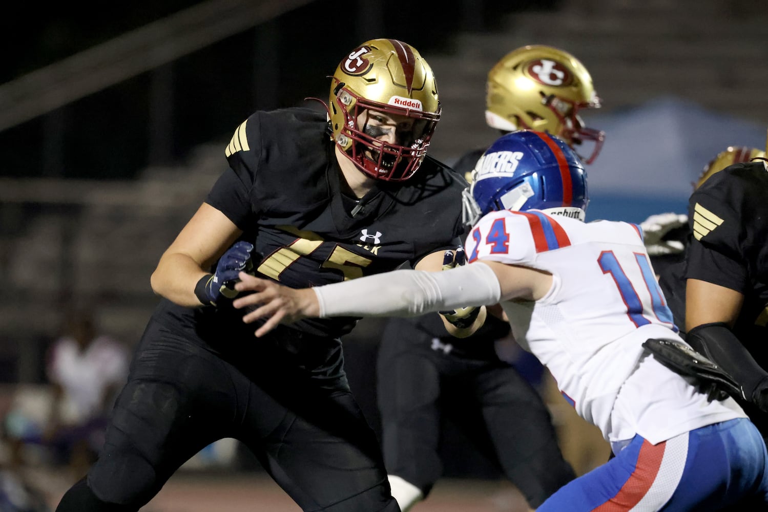 Sept. 24, 2021 - Johns Creek, Ga: Johns Creek offensive lineman Tyler Gibson (75) blocks Riverwood linebacker Gage Dwyer (14) during the second half at Johns Creek high school Friday, September 24, 2021 in Johns Creek, Ga.. Johns Creek won 40-32. JASON GETZ FOR THE ATLANTA JOURNAL-CONSTITUTION