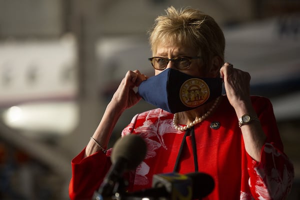 Georgia Department of Public Health Commissioner Dr. Kathleen Toomey prepares to speak at the Peachtree Dekalb Airport in Atlanta. Governor Kemp and Toomey will take part in a “Wear a Mask” Flyaround Tour of Georgia.REBECCA WRIGHT FOR THE ATLANTA JOURNAL-CONSTITUTION