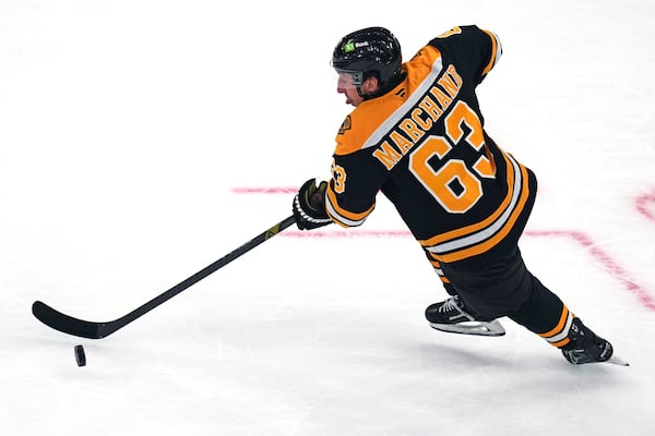 Boston Bruins left wing Brad Marchand skates against the Toronto Maple Leafs during the second period of an NHL hockey game, Tuesday, Feb. 25, 2025, in Boston. (AP Photo/Charles Krupa)