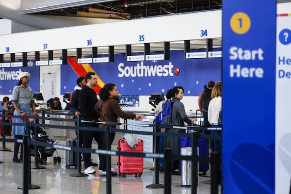 Travelers flying with Southwest Airlines wait in line at Hartsfield-Jackson International Airport in Atlanta on Dec. 30, 2022. (Natrice Miller / AJC)  