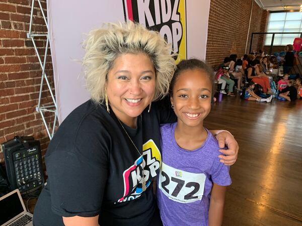 Vanessa Bryan, the vocal coach for  Kidz Bop, helped Layla, 9 and other kids at the Kidz Bop Workshop learn how to warm up their singing voices with a series of exercises.