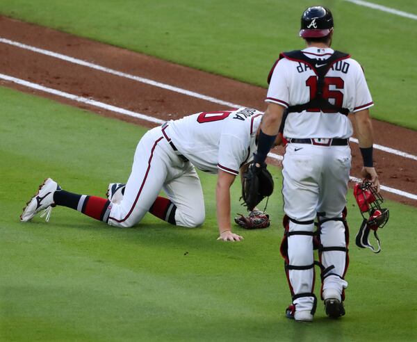 Braves starting pitcher Michael Soroka falls to the ground suffering a torn right Achilles’ tendon on Monday, Aug. 3, 2020 in Atlanta. (Curtis Compton/AJC file)