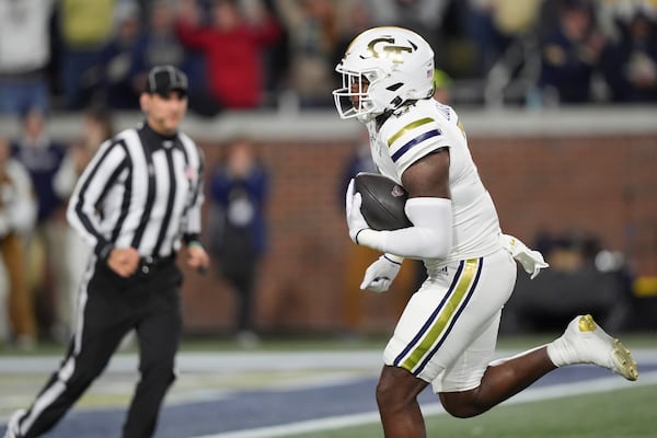 Georgia Tech linebacker E.J. Lightsey (2) runs in a touchdown after an interception during the first half of an NCAA college football game North Carolina State, Thursday, Nov. 21, 2024, in Atlanta. (AP Photo/Brynn Anderson)