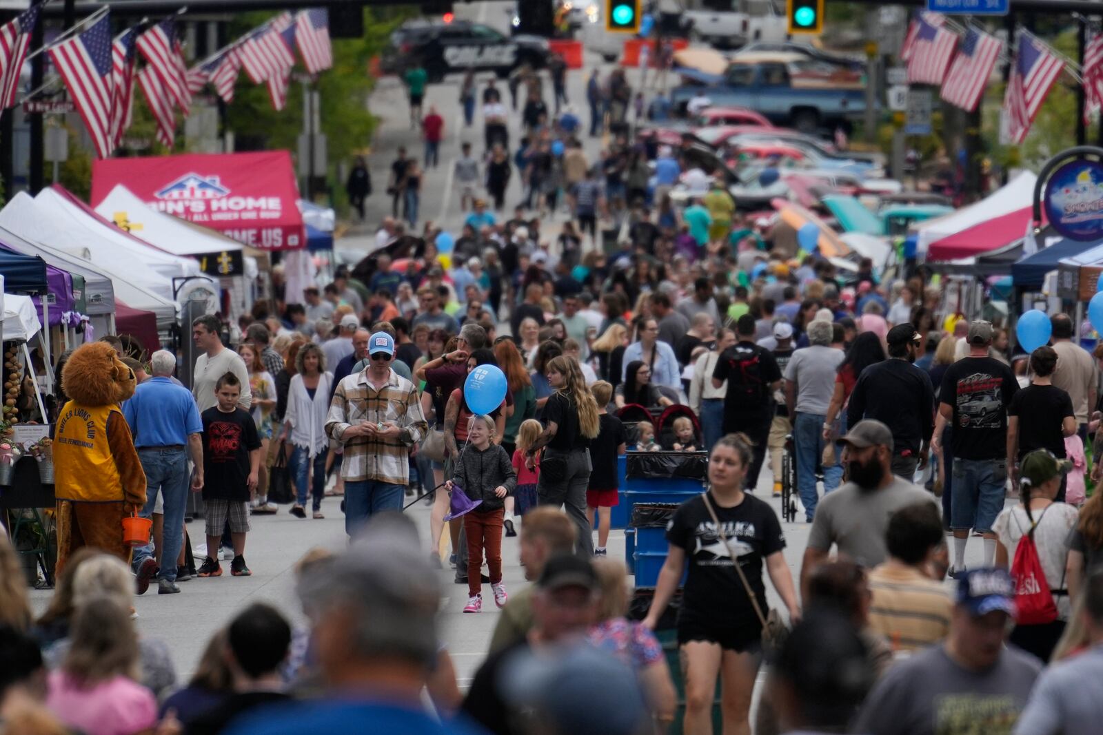 FILE - People attend the Butler Fall Festival in Butler, Saturday, Sept. 28, 2024. (AP Photo/Matt Rourke, File)