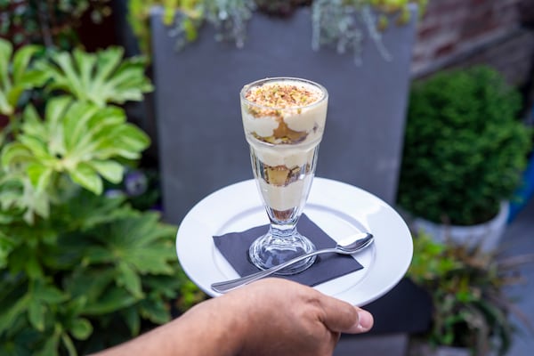 A parfait on the Kitty Dare dessert menu features roasted quince, chocolate "soil," mascarpone cream, amaretto cookie crumble and pistachio. Courtesy of Dara Paryas