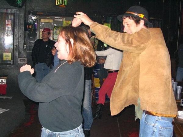 Ellyn Webb, whose love of the blues and whose welcoming personality made the Northside Tavern an Atlanta favorite, dances with Danny "Mudcat" Dudeck. Dudeck performed at the club for years, and helped to bring such blues originators as Frank Edwards and Cora Mae Bryant to perform at the club. Photo: Kelli Stripling