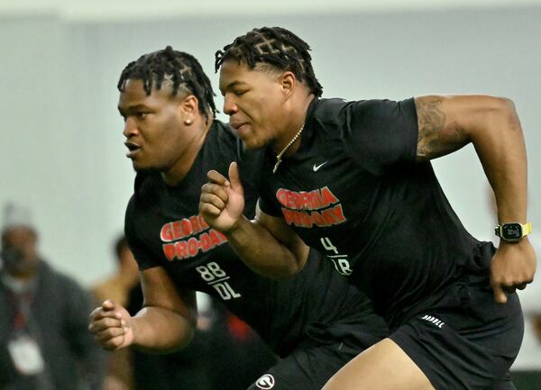 Georgia's defensive lineman Jalen Carter (left) and linebacker Nolan Smith run drills during Georgia’s Pro Day in the Payne Indoor Athletic Facility, Wednesday, March 15, 2023, in Athens, GA. (Hyosub Shin / Hyosub.Shin@ajc.com)