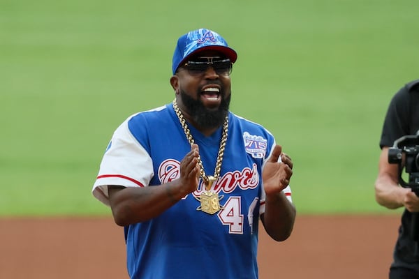 Big Boi, of OutKast, helps throw out the ceremonial pitch before the Atlanta Braves host the Milwaukee Brewers at Truist Park, Tuesday, August 6, 2024, in Atlanta. (Jason Getz / AJC)
