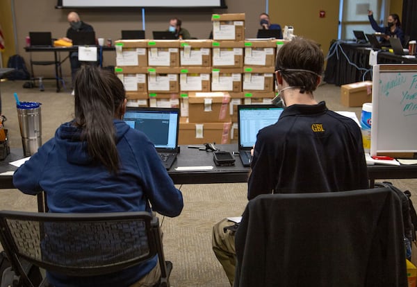  GBI agents perform an audit of absentee ballot signatures at the Cobb County Civic Center on December 22, 2020. STEVE SCHAEFER FOR THE ATLANTA JOURNAL-CONSTITUTION