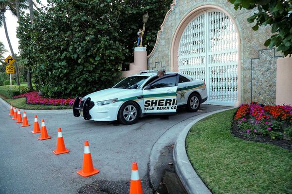 Members of the Palm Beach County Sheriff’s Office block the front entrance on A1A during President-elect Donald Trump’s stay at Mar-a-Lago in Palm Beach on November 24, 2016. (Richard Graulich / The Palm Beach Post)