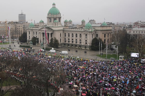 Protesters march past the Parliament building during a major rally against populist President Aleksandar Vucic and his government, in downtown Belgrade, Serbia, Saturday, March 15, 2025. (AP Photo/Darko Vojinovic)