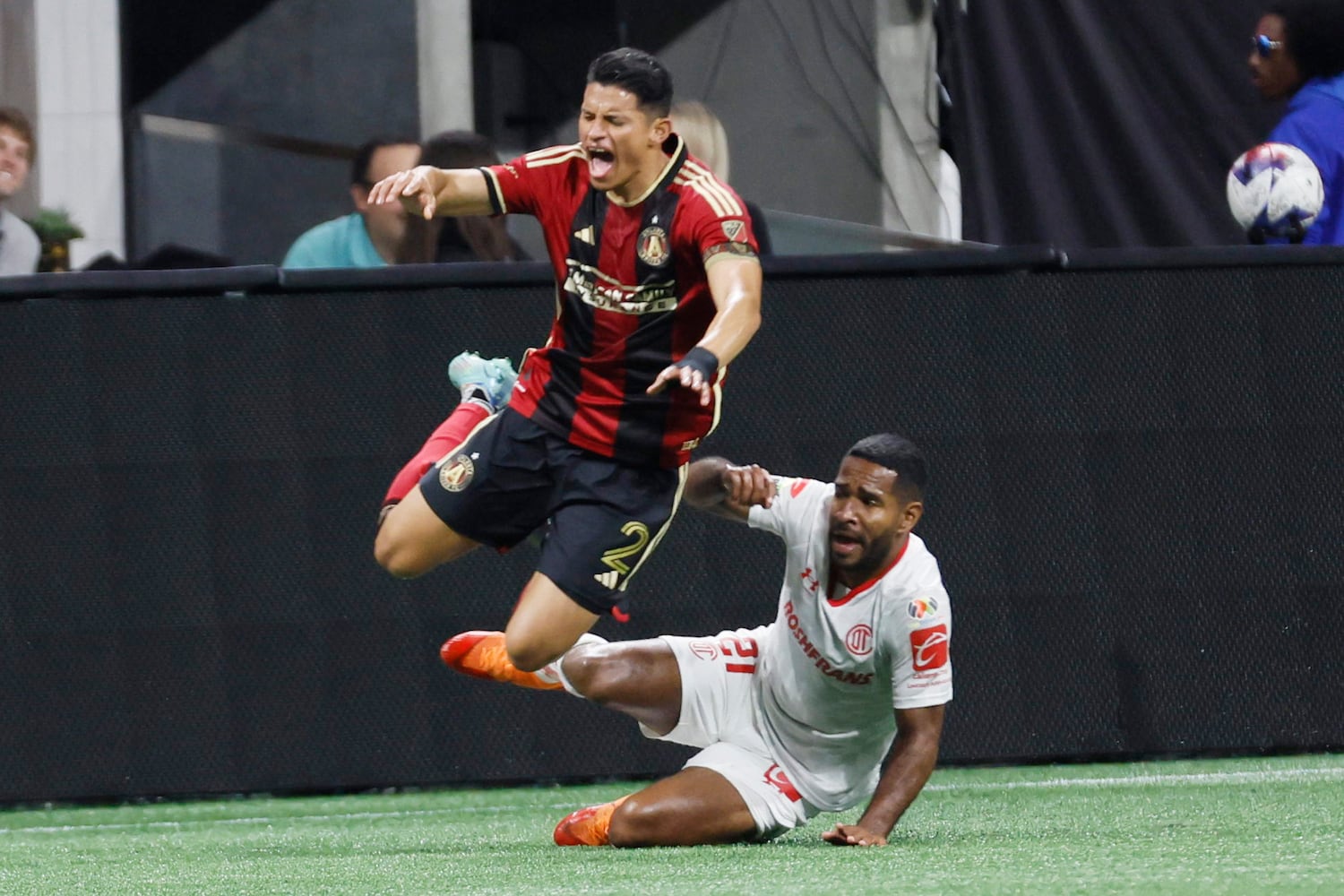 Atlanta United defender Ronald Hernandez reacts as he gets fouled by Toluca’s defender Brayan Angulo (21) during the second half against Liga MX Toluca of an exhibition match on Wednesday, Feb 15, 2023, in Atlanta.
 Miguel Martinez / miguel.martinezjimenez@ajc.com