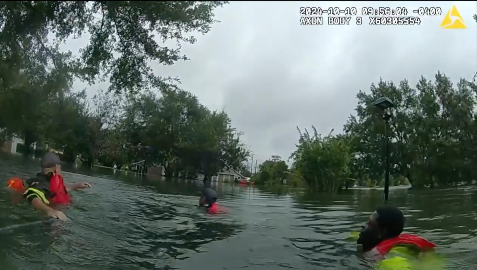 This image taken from Deland Police bodycam shows DeLand police and fire crews conduct water rescues after Hurricane Milton on Thursday, Oct. 10, 2024 in DeLand, Fla. (City of DeLand, Fla., via AP)