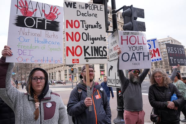 Protesters listen as Rep. Jamie Raskin, D-Md., speaks after President Donald Trump's speech at the Justice Department, Friday, March 14, 2025, outside the Department of Justice in Washington. (AP Photo/Jacquelyn Martin)