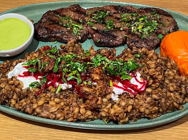 Among the menu offerings at Raik Mediterranean are a filet mignon kabob with mujadara, a lentil side dish. (Henri Hollis/henri.hollis@ajc.com)