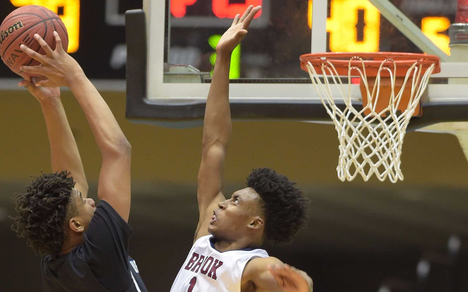 Collin Sexton (1) tries to block an opponent's shot in Macon in this 2016 photo. Sexton is mentioned in several NBA mock drafts and will play for Alabama this year.