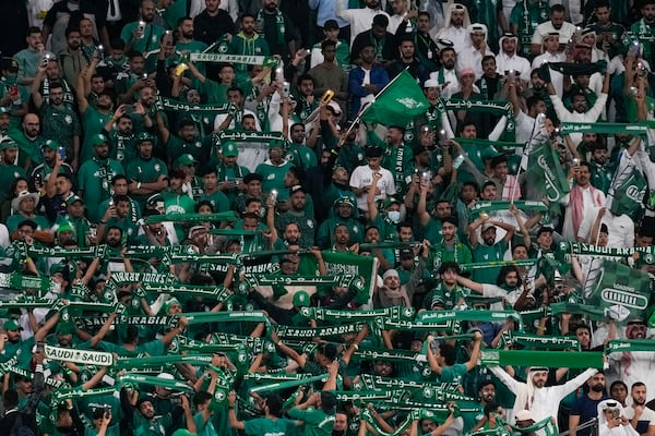 FILE - Saudi Arabia fans support their team during the Asian Cup Round of 16 soccer match between Saudi Arabia and South Korea, at the Education City Stadium in Al Rayyan, Qatar, Tuesday, Jan. 30, 2024. . (AP Photo/Thanassis Stavrakis, File)