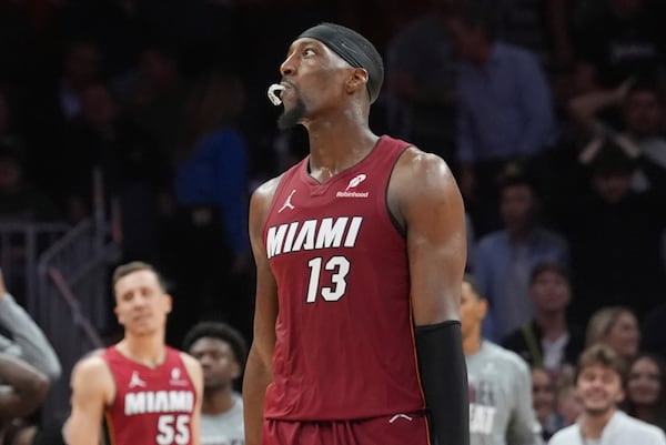 Miami Heat center Bam Adebayo (13) looks up after missing a three-point basket late in the second half of an NBA basketball game against the Charlotte Hornets, Monday, March 10, 2025, in Miami. (AP Photo/Marta Lavandier)