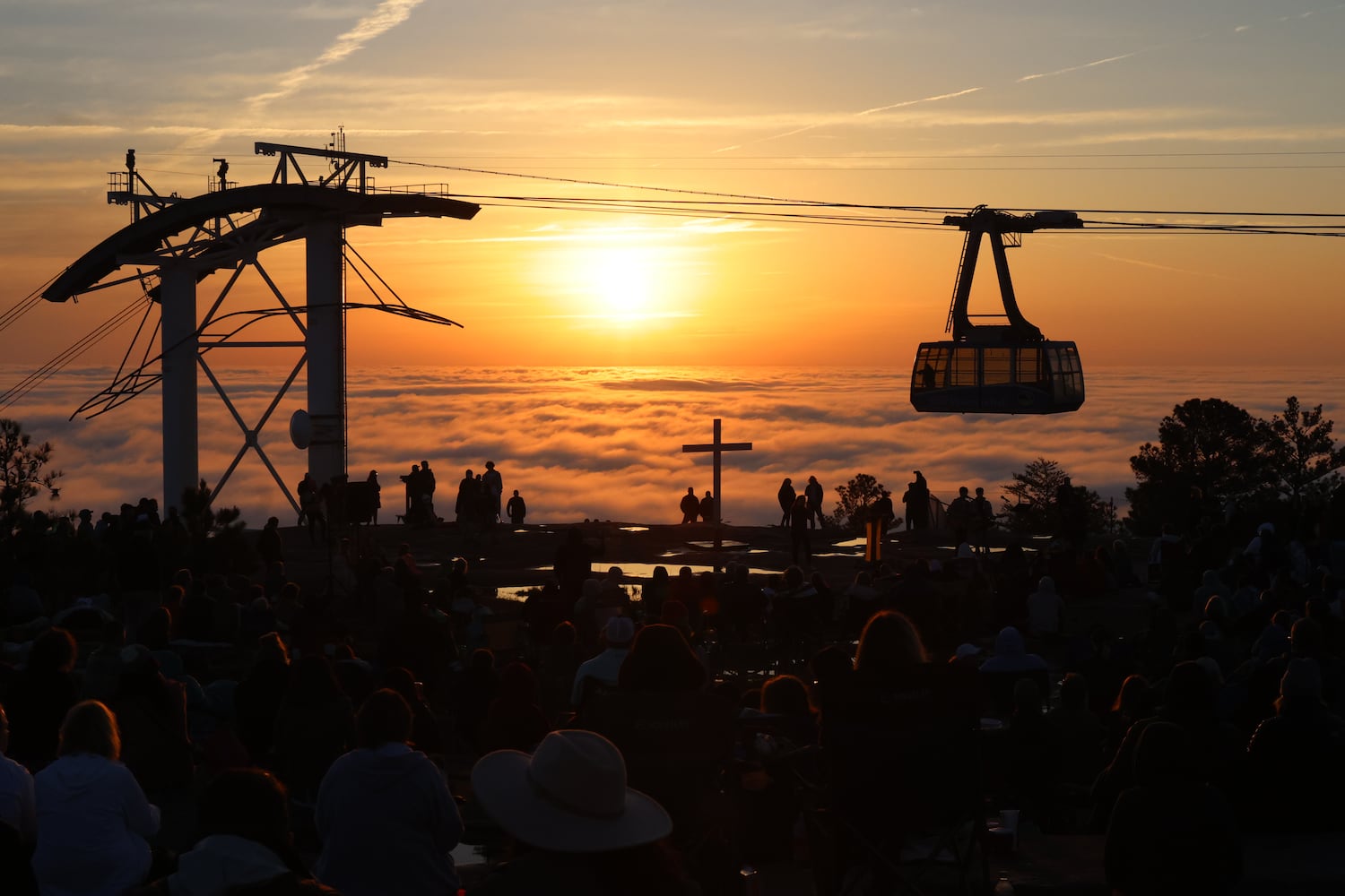 People enjoy the view on the top of Stone Mountain as the Skaylif brings more visitors to the event before starting the 76th annual Easter Sunrise Service on Sunday, April 17, 2022. Miguel Martinez/miguel.martinezjimenez@ajc.com