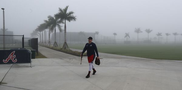 Braves infielder Austin Riley walks through the early morning fog before sunrise to hit the batting cages to begin his spring training day on Friday, Feb. 14, 2020, in North Port.  Curtis Compton ccompton@ajc.com