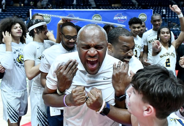 Wheeler High head coach Larry Thompson celebrates his team's Class 6A title win over Newton on Saturday.