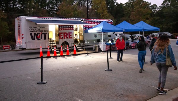 
Fulton County used two voting buses, which served more than 112,000 voters. This bus was set up at Wolf Creek Library after the library lost power during a tropical storm. Senate Bill 202 now restricts voting buses to emergencies declared by the governor. (STEVE SCHAEFER / SPECIAL TO THE AJC)