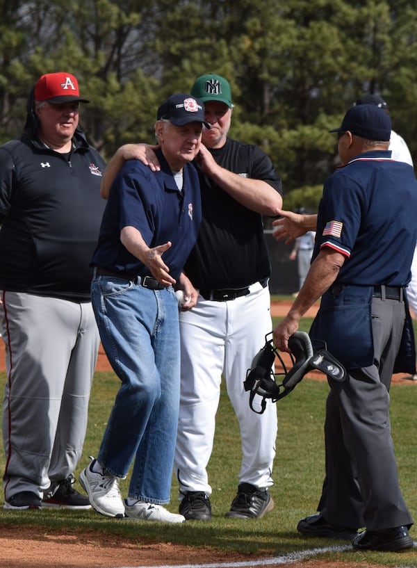 Keith Hansen (left) and George Hanson (right), with their father, also George (center) on the baseball diamond.