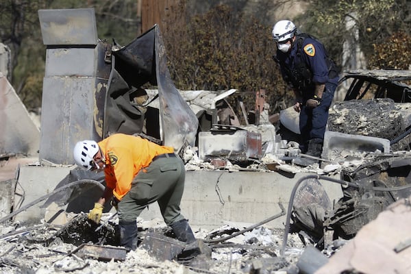 Search and rescue workers dig through the rubble left behind by the Eaton fire in Altadena, Calif., on Tuesday, Jan. 14, 2025. (Ty O'Neil/AP)