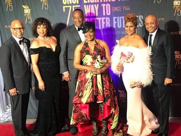 Atlanta Mayor Keisha Lance Bottoms, center, poses for a photo at the UNCF Mayor's Masked Ball. The event raised a record $1.4 million in college scholarships for the nonprofit organization.