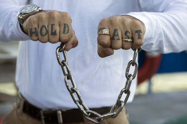 SAVANNAH, GA - OCTOBER 23, 2019: Joining scientists aboard the R/V Savannah, Capt. Mike Younce, a shrimper from Brunswick, Ga., shows the tattoo on his hands that serve as a reminder to “Hold Fast” as the vessel sails to fish the commercial fishing grounds in Wassaw Sound. Younce was onboard to bring his vast experience as a shrimper to the crew of biologist researching black gill in local shrimp. (AJC Photo/Stephen B. Morton)