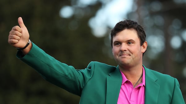 Masters winner Patrick Reed celebrates during the green jacket ceremony at the 2018 Masters Tournament Sunday  April 8, 2018, at Augusta National Golf Club.