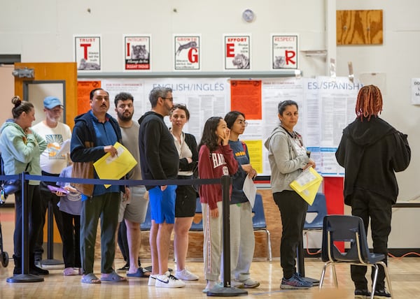 Gwinnett County voters cast their ballots on Election Day at W.J. Cooper Elementary School in Loganville on Tuesday, Nov 5, 2024. More than 500 people had voted by 10 am at this location.  (Jenni Girtman for The Atlanta Journal-Constitution)