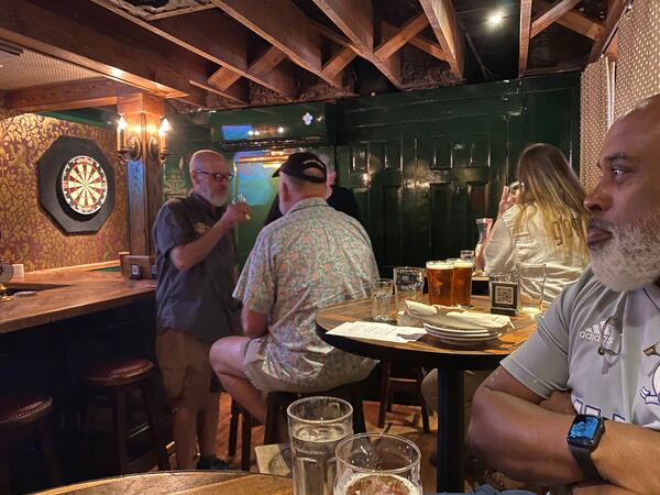 Friends gather for cask-condition ale, lunch, and a soccer match at the Brick Store Pub’s new Cask Bar. (Bob Townsend for The Atlanta Journal-Constitution)