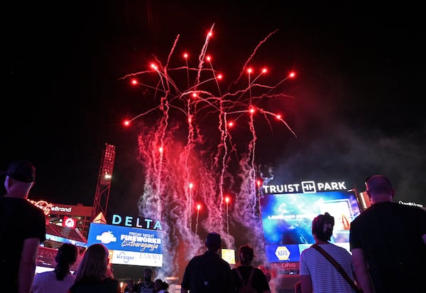 Baseball fans watch fireworks after the win. (Hyosub Shin / Hyosub.Shin@ajc.com)