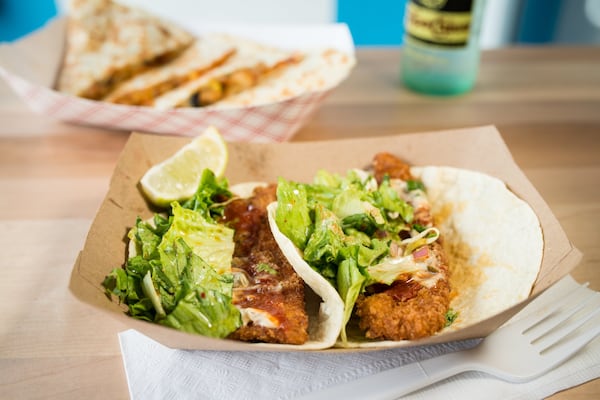  Fish tacos with panko crusted tilapia, hoisin tartar sauce, Yumbii korean BBQ sauce, and soy-sesame vinaigrette salad. Photo credit- Mia Yakel.