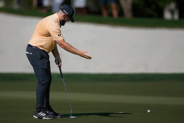 Tyrell Hatton of England reacts after he missed a shot on the 13th green during the second round of World Tour Golf Championship in Dubai, United Arab Emirates, Friday, Nov. 15, 2024. (AP Photo/Altaf Qadri)