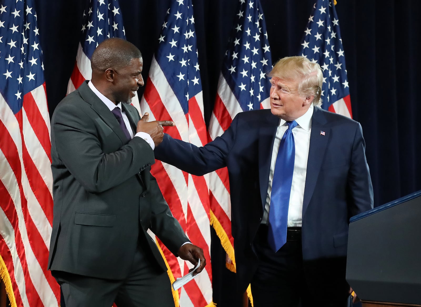 November 8, 2019 Atlanta: Paul Morrow, a concrete business owner, joins the stage with President Donald Trump during the Black Voices for Trump Coalition Rollout on Friday, November 8, 2019, in Atlanta.   Curtis Compton/ccompton@ajc.com