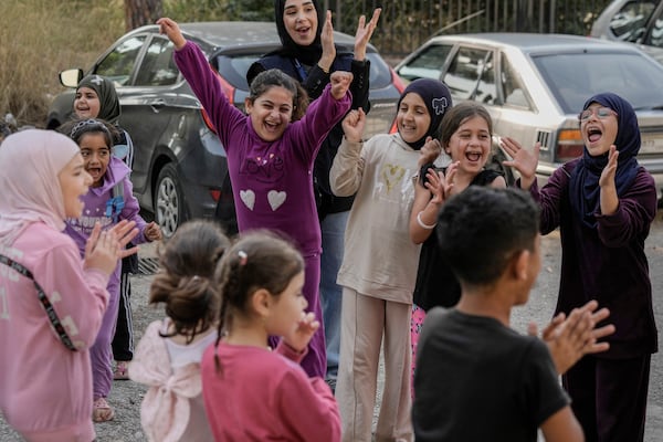 Displaced children take part in activities for mental healthcare, organized by the International Medical Corps, at a shelter housing them in Dekwaneh, east Beirut, Lebanon, Thursday, Nov. 7, 2024. (AP Photo/Bilal Hussein)