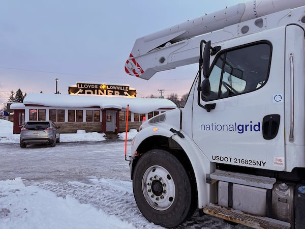 Utility crews fuel up during a snow storm in Lowville, N.Y., on Sunday Dec, 1, 2024. (AP Photo/Cara Anna)