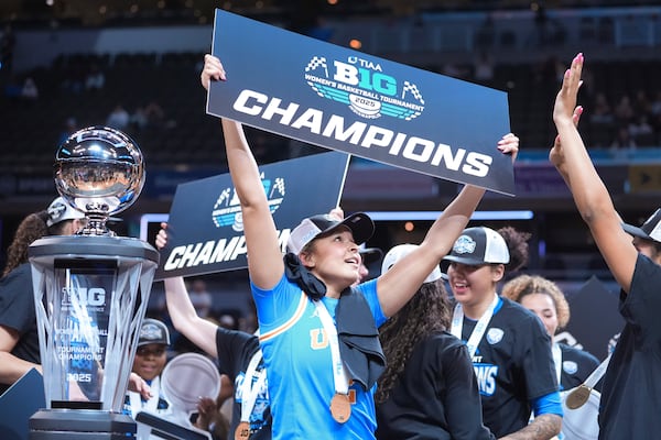 UCLA players celebrate after an NCAA college basketball game against Southern California in the championship of the Big Ten Conference tournament in Indianapolis, Sunday, March 9, 2025. (AP Photo/Michael Conroy)