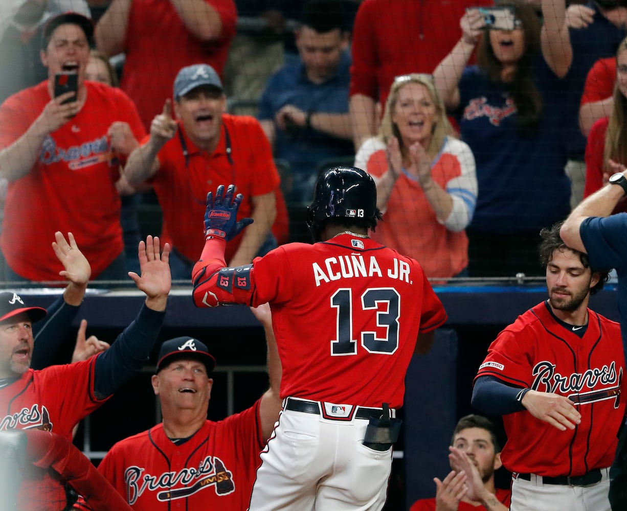 Photos: Braves break out red uniforms, host Marlins