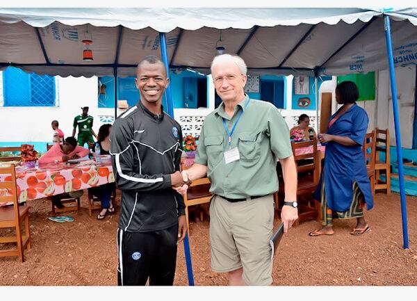 Samuel "Sam" Johson and John Marson Dunaway, Professor Emeritus of French and Interdisciplinary Studies at Macon's Mercer University, pose for a picture during Dunaway's visit to Home of Hope, the orphanage Johnson started in West Africa with help from Dunaway and others. Courtesy of John Marson Dunaway