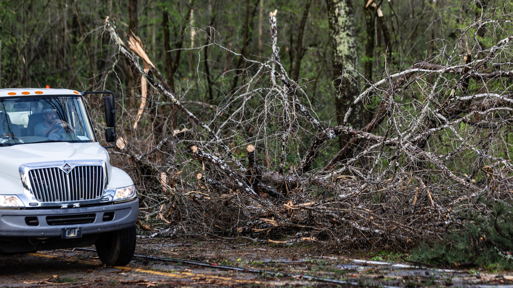 Stormy weather late Tuesday and early Wednesday left damage and blocked roads along McDaniel Mill Road in Conyers. (John Spink / John.Spink@ajc.com)