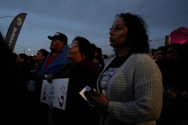 People attend a vigil for slain Native American teen Emily Pike in Mesa, Ariz., Thursday, March 6, 2025. (AP Photo/Samantha Chow)