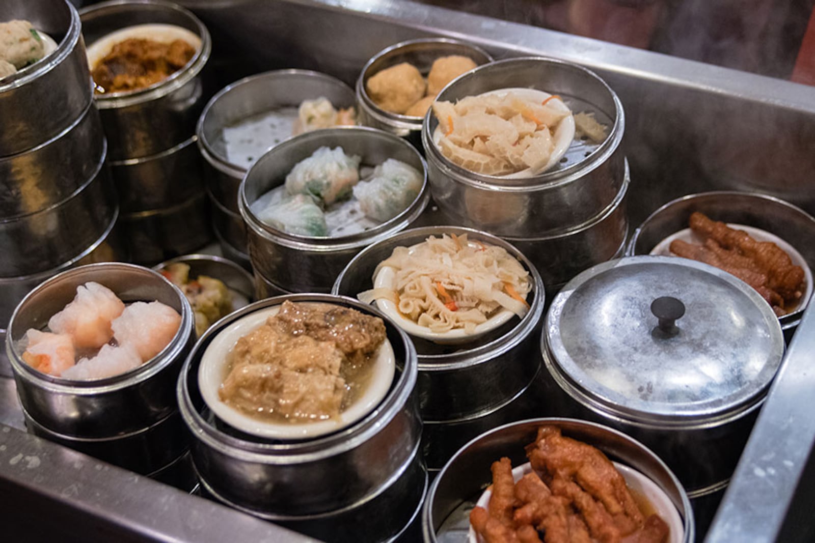 Dim sum carts billow steam as they're wheeled between the tables at Royal China in Chamblee. CONTRIBUTED BY HENRI HOLLIS